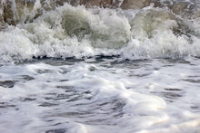 Nature Close-up Details: Frothy White Splashing Water From A Breaking Ocean Wave