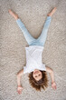 © deagreez - Top above high angle view photo of young little girl happy positive smile lying floor wear casual outfit home