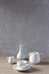 Wall Mural - Empty crockery set or ceramic dishes. White kitchen dishware and tableware on table