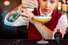 Barman With Dropper Preparing Alcoholic Cocktail