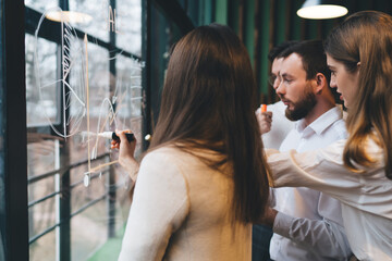 Wall Mural - Group of pensive colleagues discussing project