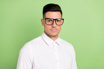 Photo of pretty confident young guy dressed white shirt glasses isolated green color background