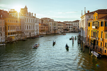 landscape with gondola, motorboat and grand canal