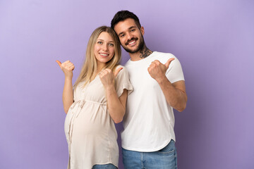 Wall Mural - Young couple pregnant and with thumb up