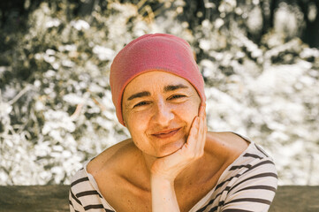 portrait of young woman with happy attitude and will to live with cancer medication