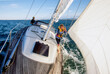 © SuperStock - Father and young daughter on yacht sailing on calm water