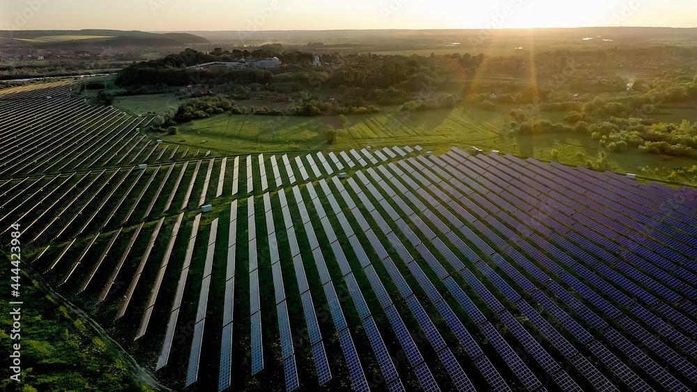 Ecology solar power station panels in the fields green energy at sunset ...