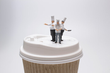 a mini figure of the chef on the paper mug