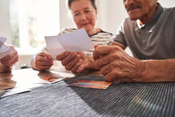 Poster - People watching photos and remembering funny memories from their life