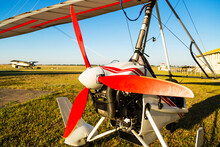 Close Up Of Propellerof Motor Hang Glider Standing On Green Grass At Aerodrome, Bright Summer Day
