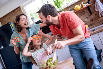 Canvas Print - Happy family cook at home in the kitchen