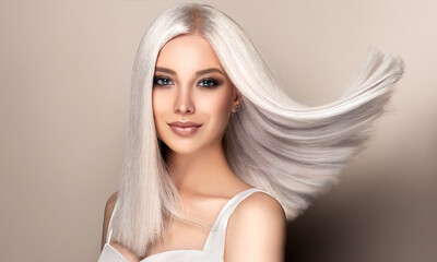beautiful girl with hair coloring in ultra blond. stylish hairstyle done in a beauty salon. fashion,