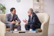 © Elnur - Two businessmen discussing project at workplace