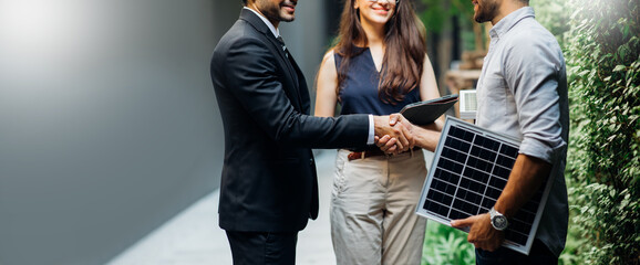 Electrical Engineer Technician and CEO executive business people making handshake after meeting. clean and green alternative energy concept.