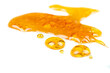 golden drops cannabis wax close up macro on white background