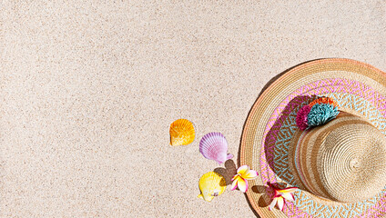 Wall Mural - Summer hat and sea shells on sand, top view, copy space