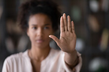 Close Up Of African American Woman Showing Stop Gesture With Hand Blurred Background, Young Female Protesting Against Domestic Violence And Abuse, Bullying, Saying No To Gender Discrimination