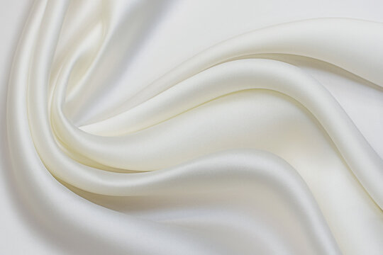 Wall Mural -  - Milky-colored silk fabric in artistic layout. Texture, background, pattern.