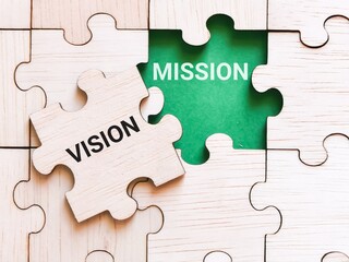 Vision mission concept. Phrase vision mission written on jigsaw puzzle.