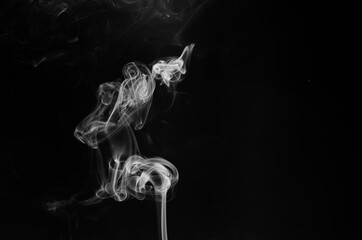 abstract fragment movement of white smoke on black background.