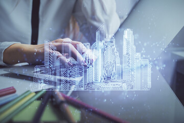 Poster - Double exposure of woman hands typing on computer and buildings drawing. Smart-city concept.