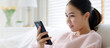 © ChayTee - Young asia people 5G wifi digital device user teen girl watch read news play social media, e-commerce iot data app, pay money, remote shop retail store at home sofa couch sit easy relax happy smile.