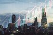 Multi exposure of virtual creative financial chart hologram on Chicago skyscrapers background, research and analytics concept