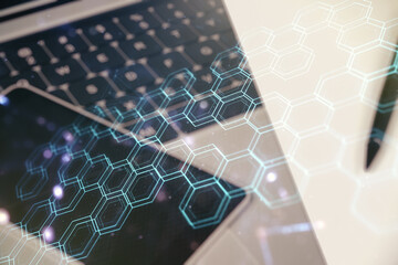 Poster - Creative concept of wireless technology with hexagon hologram on modern laptop background. Big data and database concept. Multiexposure