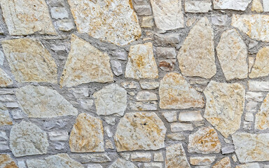 rough stone wall closeup, seamless natural background