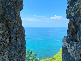 Canvas Print - Sea view through stone cliffs.  Beautiful blue calm seascape of Mediterranean coast at summer season. Sunny summer day by sea. Summertime, nature, sun, nature, relax, vacation.