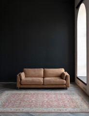 Wall Mural - Comfortable sofa with pillows in the interior of a spacious living room, real photo with copy space on an empty black wall