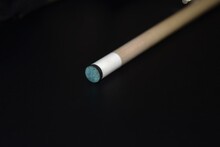 Tip Of A Pool Cue On Black Background