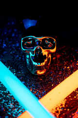 Sticker - Closeup of a skull illuminated with colorful neon lights