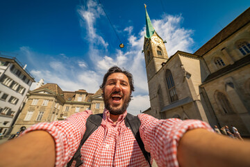 Wall Mural - happy tourist man taking a selfie photo in Zurich, Switzerland