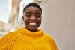 © Krakenimages.com - Young african american woman smiling happy standing at the city.