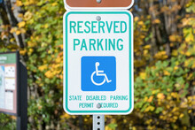 Reserved parking for a person with disability signage on a metal post at Tacoma in Washington
