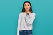 © Krakenimages.com - Young hispanic girl wearing casual clothes looking at the camera blowing a kiss with hand on air being lovely and sexy. love expression.