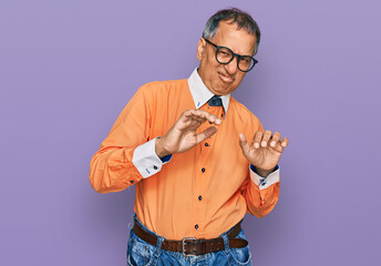 Poster - Middle age indian man wearing casual clothes and glasses disgusted expression, displeased and fearful doing disgust face because aversion reaction. with hands raised