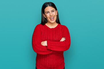 Canvas Print - Beautiful brunette woman wearing casual sweater happy face smiling with crossed arms looking at the camera. positive person.