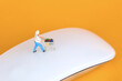 Shopper's miniature model on the wireless mouse