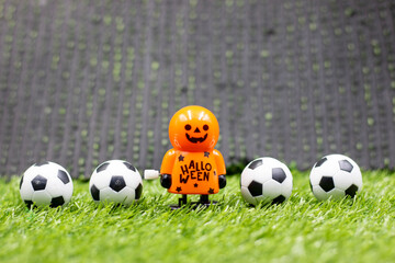 Wall Mural - Ghost is playing soccer ball on Halloween Day