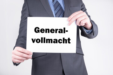 Anwalt mit einer Tafel auf der Generalvollmacht steht