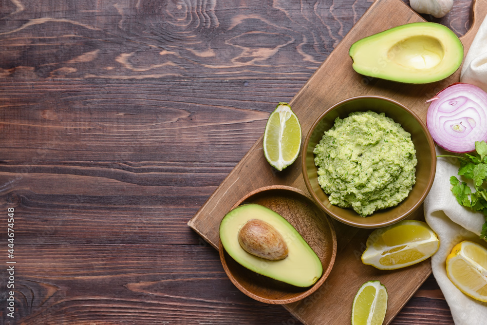 Composition with tasty guacamole on wooden background