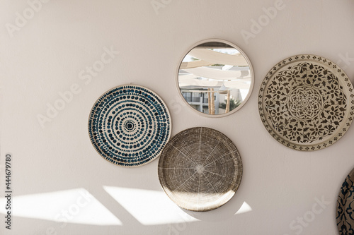 Traditional oriental ornamental ceramic plates on white wall