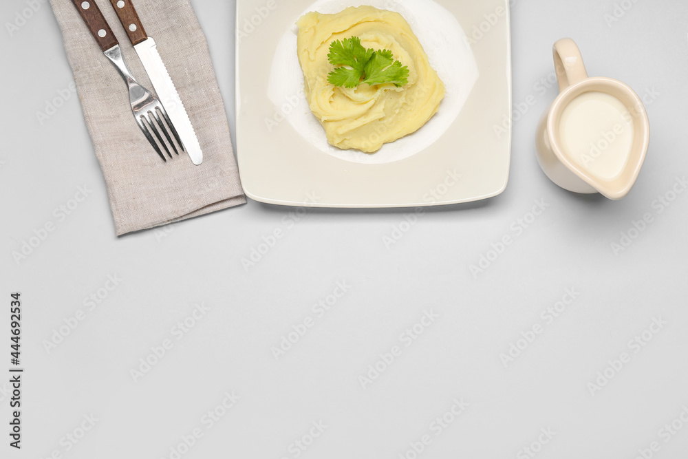 Composition with tasty mashed potatoes on light background
