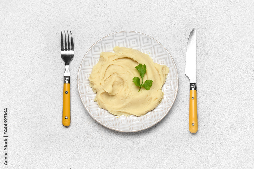 Composition with tasty mashed potatoes on light background