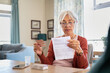 © Rido - Senior woman checking medicine leaflet