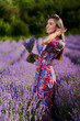 © Xalanx - Young woman in a lavender field at sunset