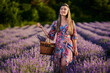 © Xalanx - Young woman with a basket in a lavender field