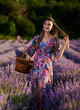 © Xalanx - Young woman with a basket in a lavender field